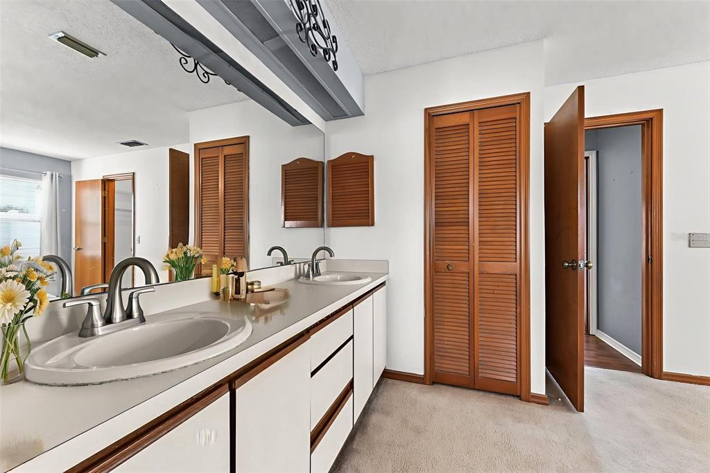 1580 East Normandy Boulevard Deltona, FL 32725 - Photo 20 of 46 a bathroom with a sink and a mirror