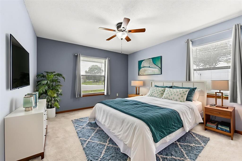 1580 East Normandy Boulevard Deltona, FL 32725 - Photo 24 of 46 a bedroom with a large bed and a window