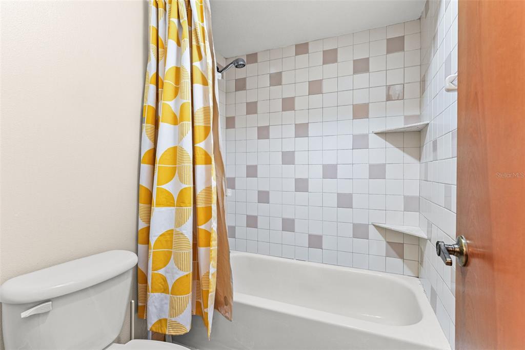 1580 East Normandy Boulevard Deltona, FL 32725 - Photo 27 of 46 a bathroom with a bathtub and a shower