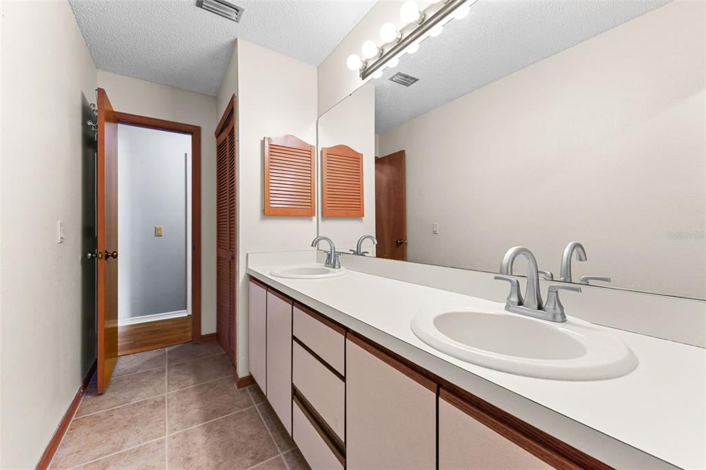 1580 East Normandy Boulevard Deltona, FL 32725 - Photo 28 of 46 a bathroom with a sink and a mirror