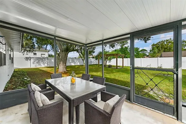a view of an outdoor dining space with furniture