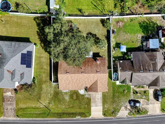 an aerial view of house with a swimming pool