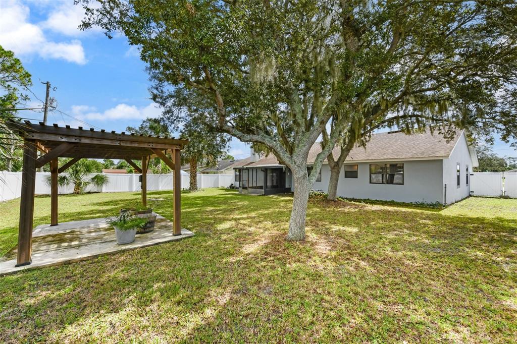 1580 East Normandy Boulevard Deltona, FL 32725 - Photo 38 of 46 a front view of a house with garden