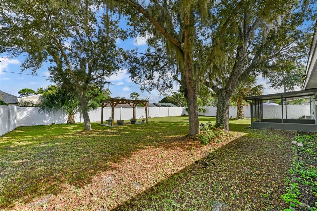 1580 East Normandy Boulevard Deltona, FL 32725 - Photo 40 of 46 a view of a house with a yard