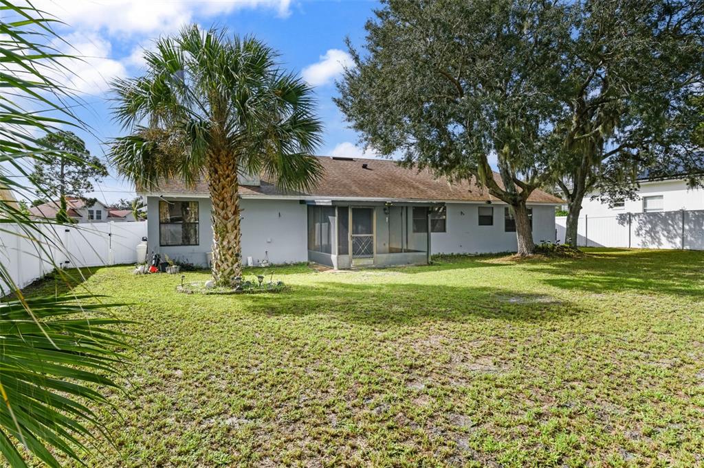 1580 East Normandy Boulevard Deltona, FL 32725 - Photo 42 of 46 a front view of a house with a yard