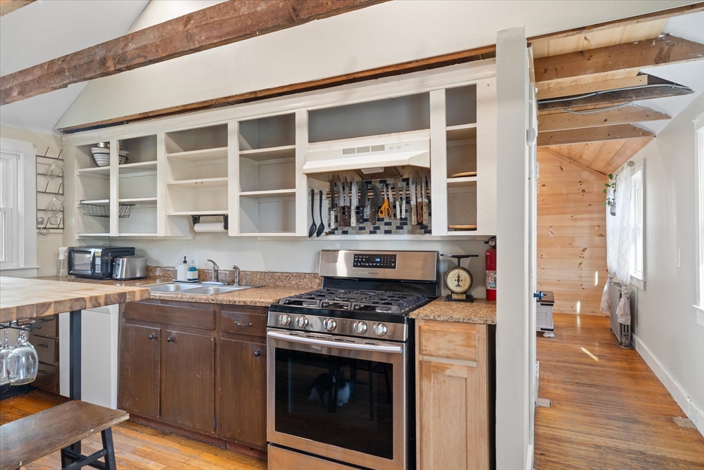 1350 Thresher Road Hardwick, MA 01037 - Photo 14 of 37 a kitchen with stainless steel appliances granite countertop a stove and a cabinets