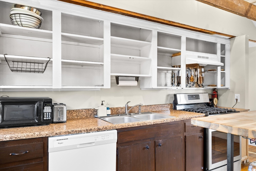 1350 Thresher Road Hardwick, MA 01037 - Photo 16 of 37 a kitchen with stainless steel appliances granite countertop a sink and a stove