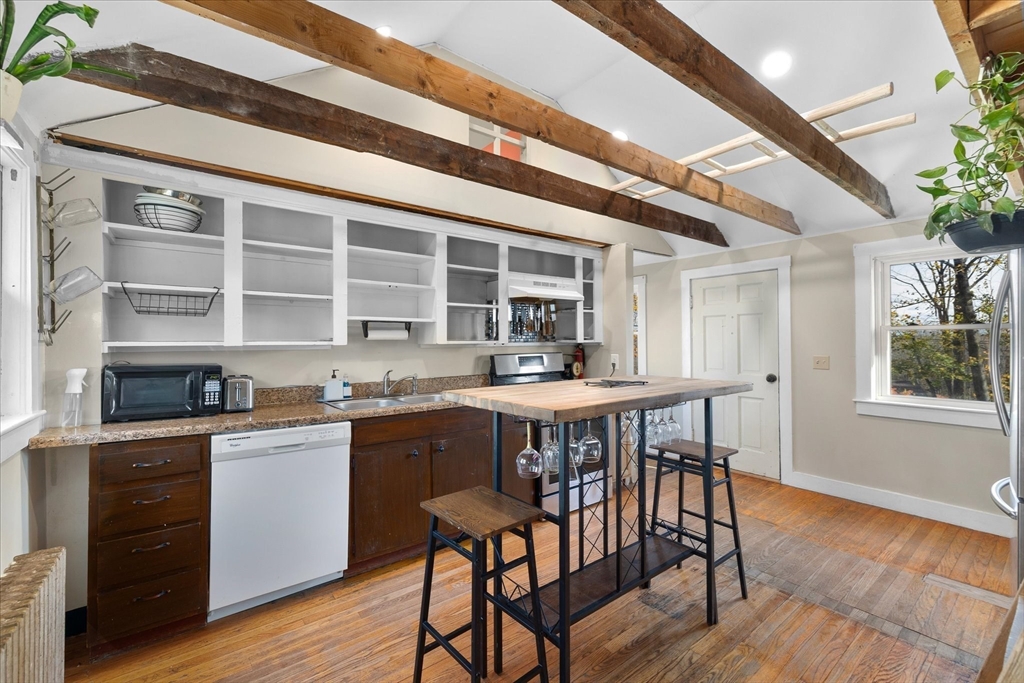 1350 Thresher Road Hardwick, MA 01037 - Photo 17 of 37 a dining room with a wooden table and chairs