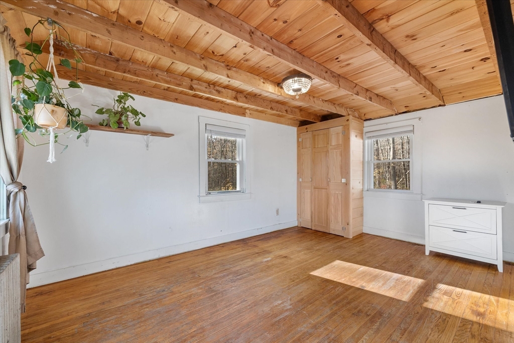 1350 Thresher Road Hardwick, MA 01037 - Photo 20 of 37 a view of an empty room with a window