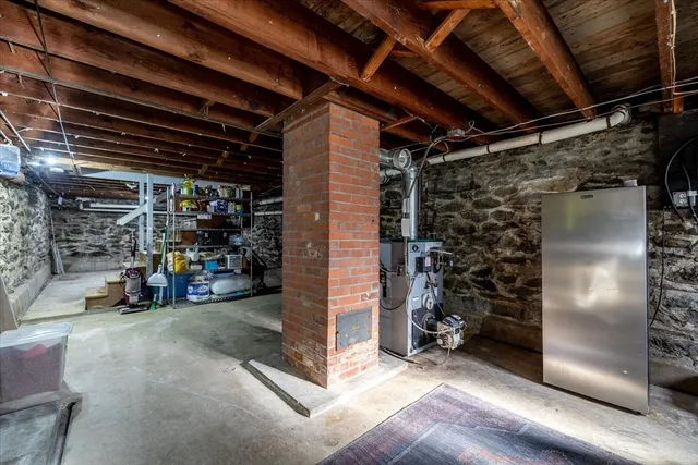 a view of water heater room with gym equipment