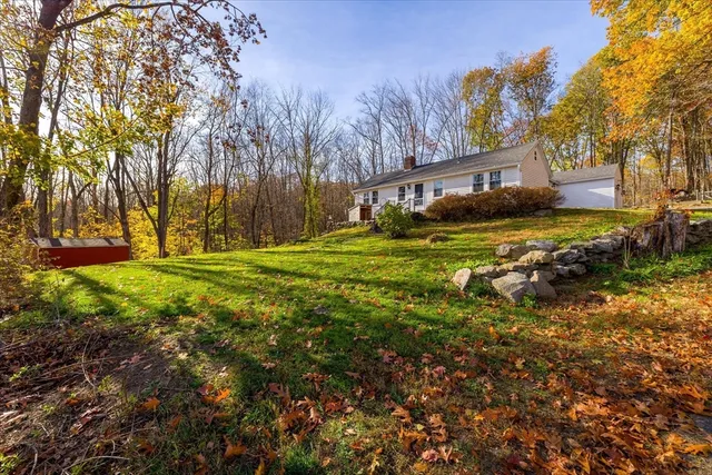 a view of a house with a yard