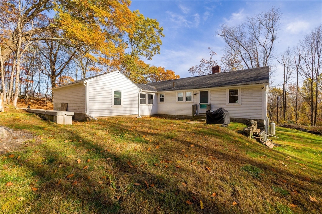 1350 Thresher Road Hardwick, MA 01037 - Photo 37 of 37 a view of a yard with a house and a tree