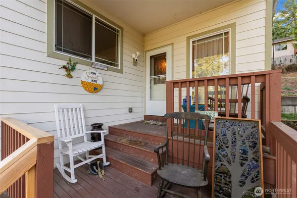 a view of living room kitchen and deck