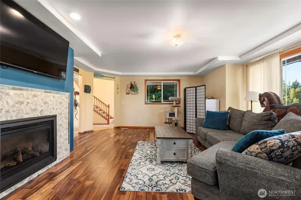 a living room with furniture and a fireplace