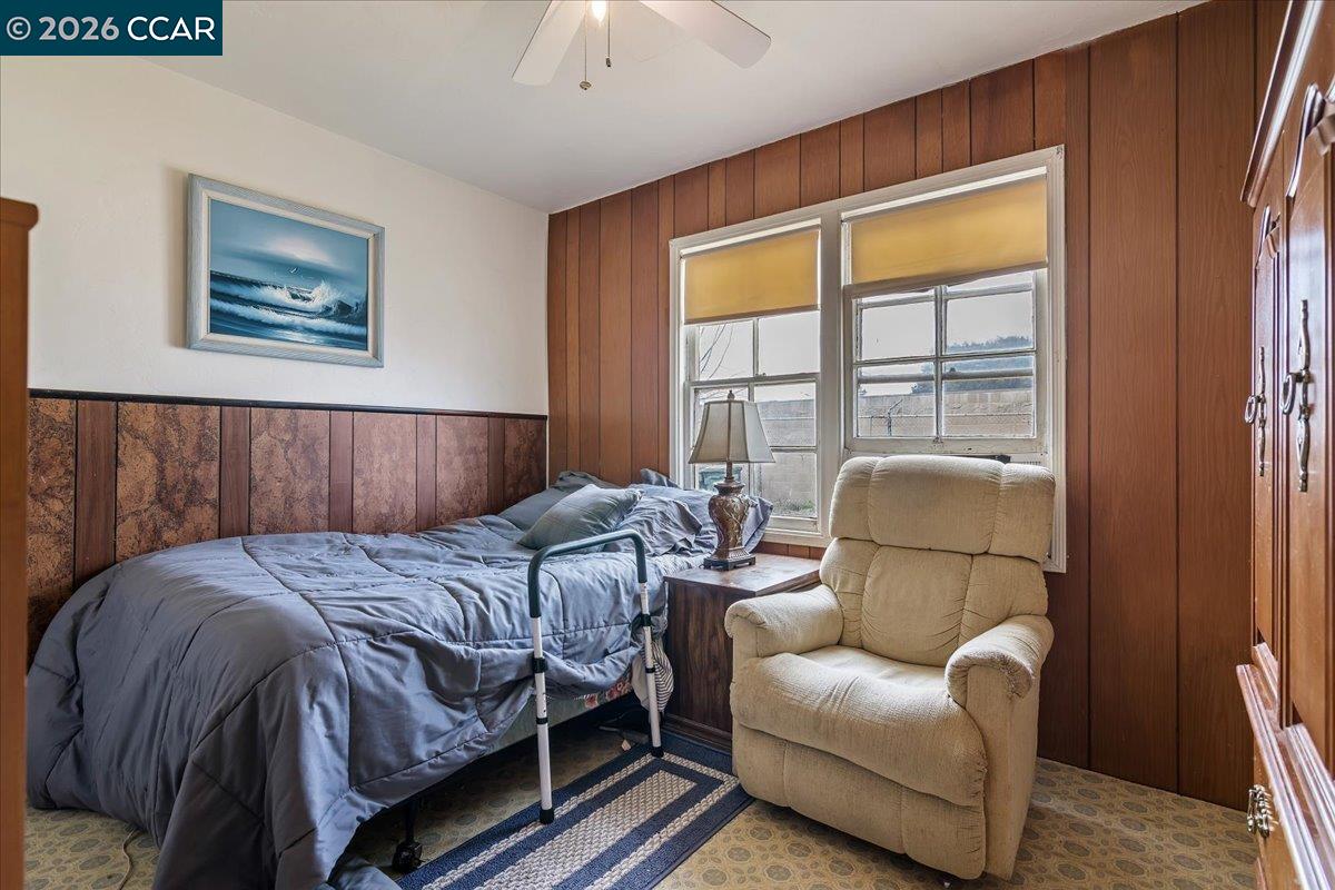 178 Army Street Pittsburg, CA 94565 - Photo 14 of 24 a bedroom with bed couch and window