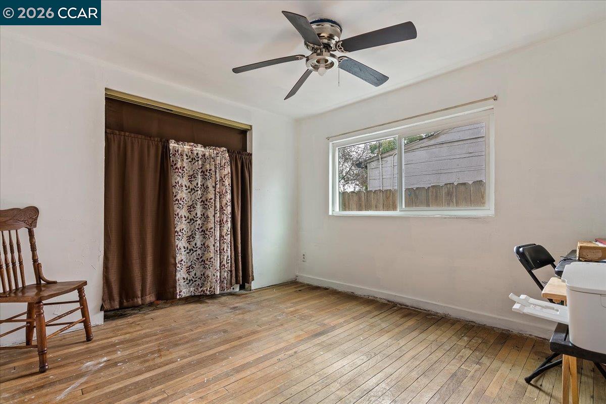 178 Army Street Pittsburg, CA 94565 - Photo 18 of 24 a view of workspace with wooden floor ceiling fan