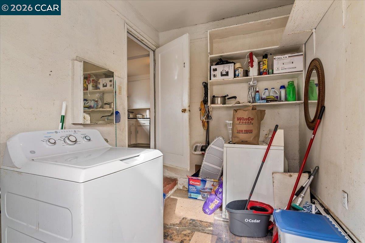 178 Army Street Pittsburg, CA 94565 - Photo 20 of 24 a utility room with fridge and wooden floor