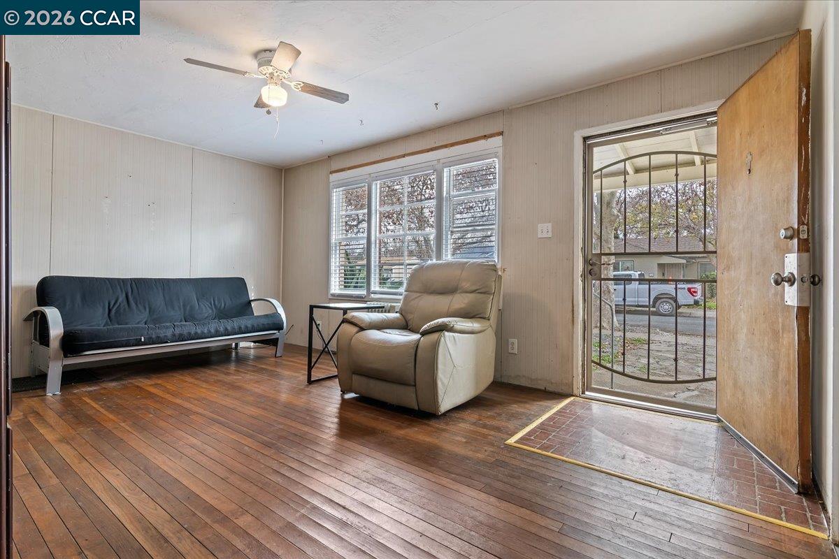 178 Army Street Pittsburg, CA 94565 - Photo 6 of 24 a living room with furniture and a flat screen tv