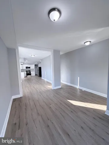 a view of a livingroom with wooden floor