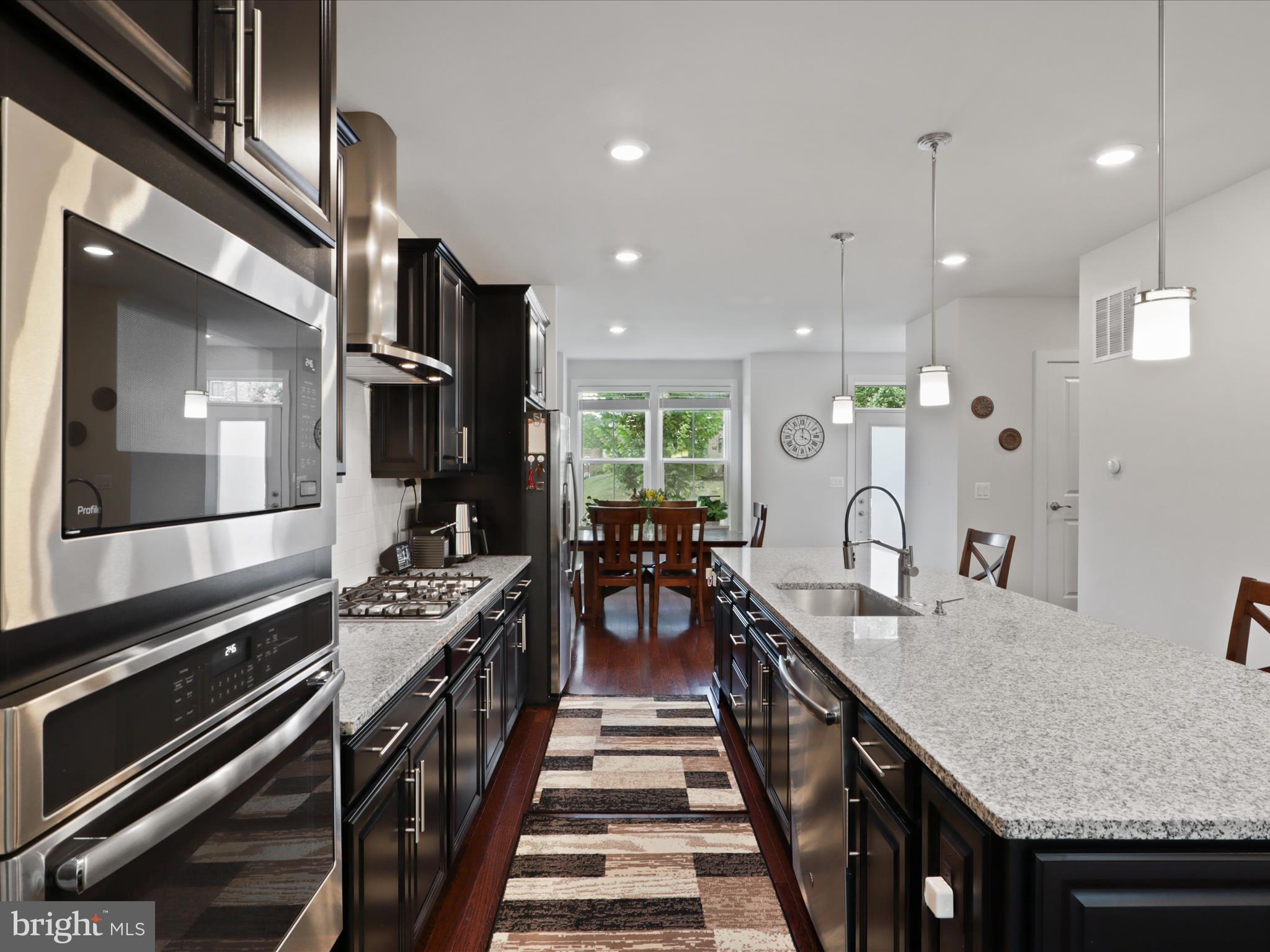 5742 10th Road North Arlington, VA 22205 - Photo 12 of 44 a kitchen with counter top space appliances and a ceiling fan