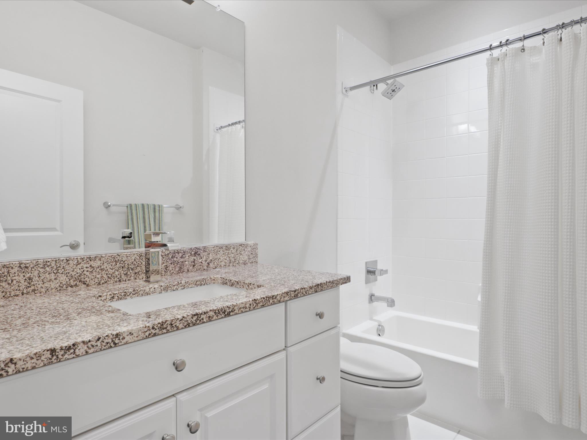 5742 10th Road North Arlington, VA 22205 - Photo 31 of 44 a bathroom with a granite countertop sink toilet and shower