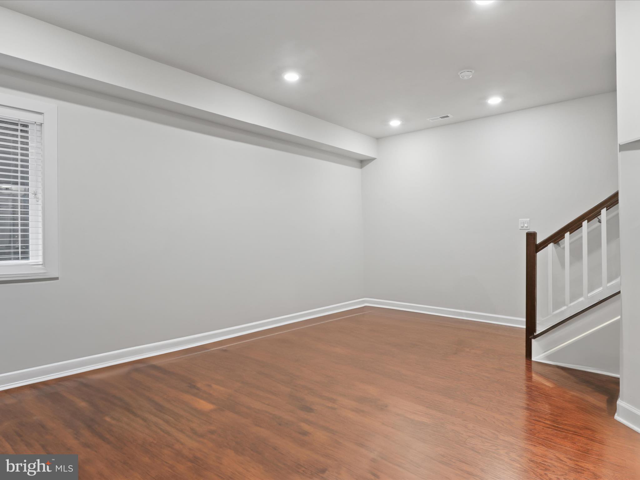5742 10th Road North Arlington, VA 22205 - Photo 34 of 44 a view of an empty room with wooden floor