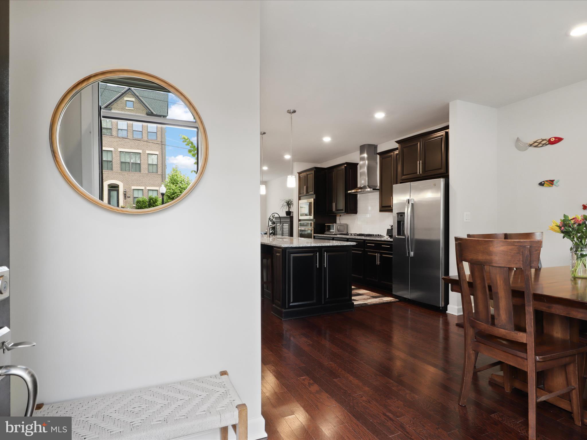 5742 10th Road North Arlington, VA 22205 - Photo 6 of 44 a kitchen with a table and chairs