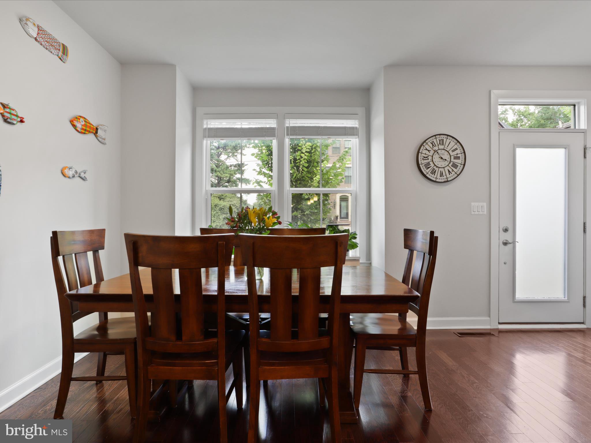 5742 10th Road North Arlington, VA 22205 - Photo 9 of 44 a view of a dining room with furniture window and wooden floor