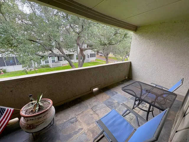 a spacious bedroom with a bed and a window