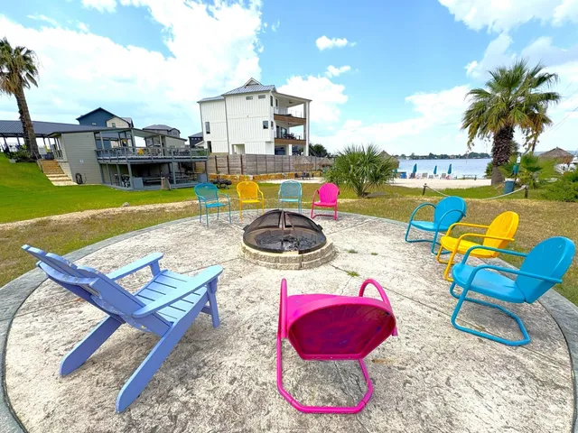 a swimming pool with outdoor seating and city view