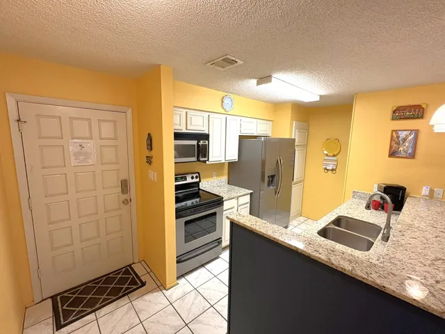 a view of a livingroom with furniture and a table