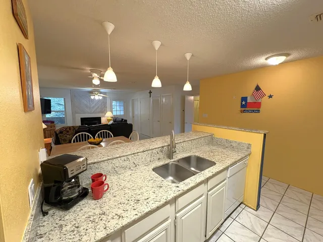 a view of a livingroom with furniture and a chandelier