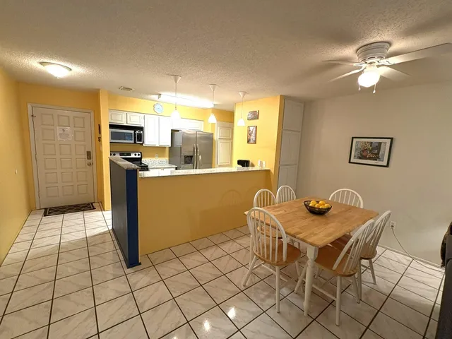 a living room with furniture fireplace and a flat screen tv