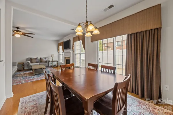 a view of a dining room with furniture and window