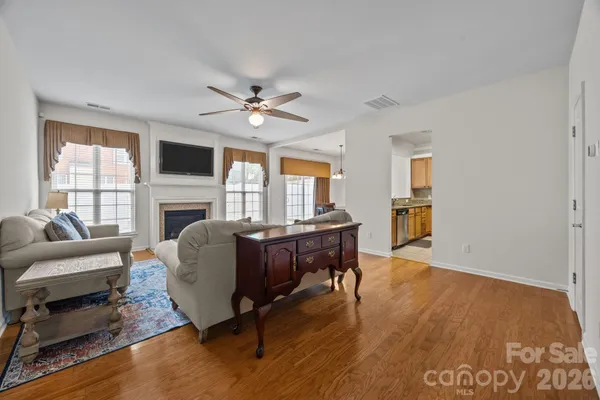 a view of a dining room with furniture and wooden floor