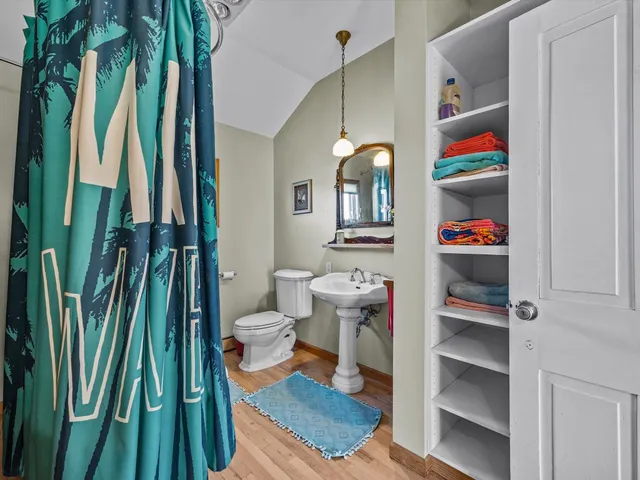 a living room filled with furniture and a book shelf