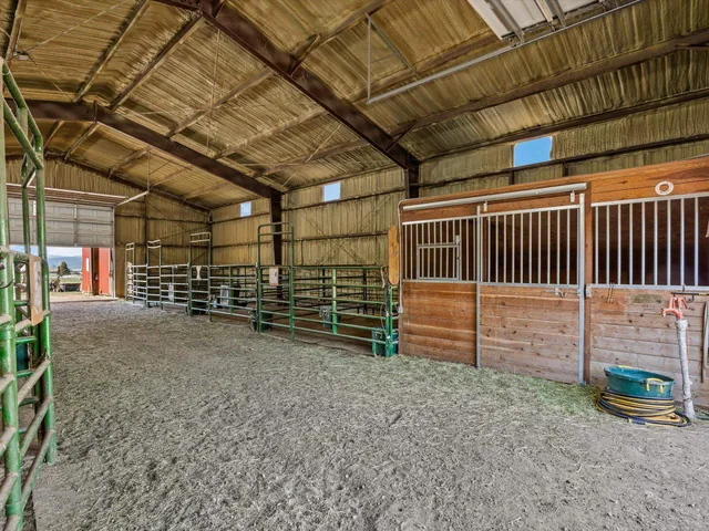 a view of empty room with wooden ceiling