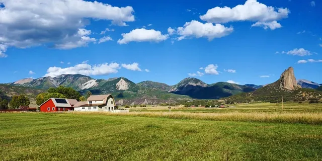 a view of a playground with a mountain