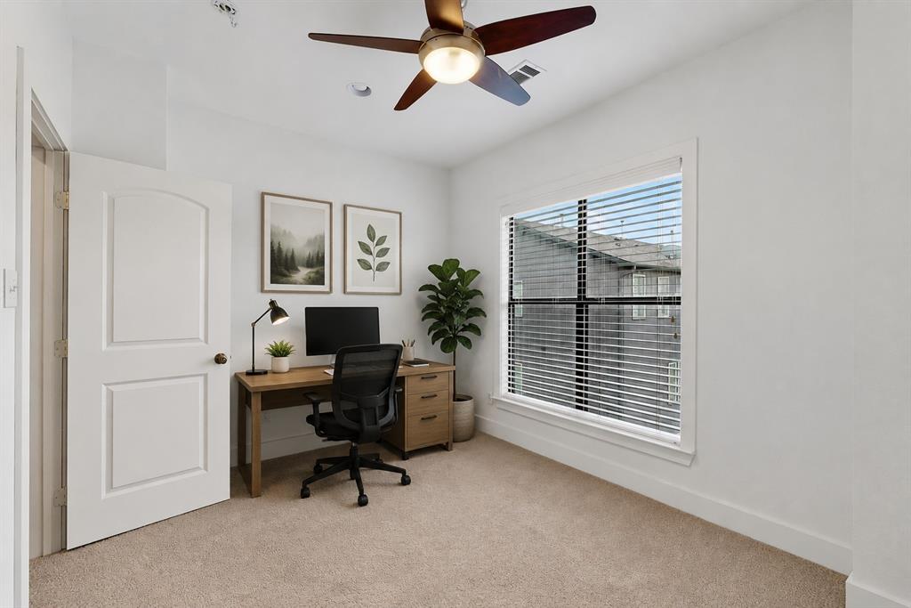 4211 Rawlins Street, Unit 528 Dallas, TX 75219 - Photo 11 of 14 Neutral-toned carpeting paired with white walls