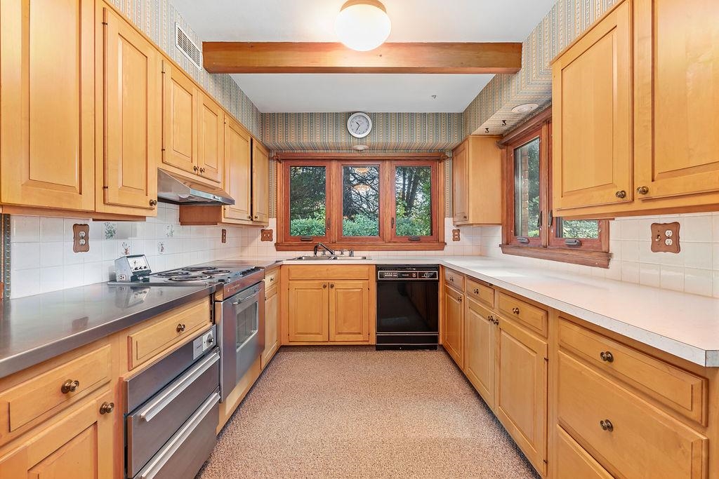 3723 Brookview Road Rockford, IL 61107 - Photo 12 of 44 a kitchen with granite countertop a sink a counter space appliances and cabinets