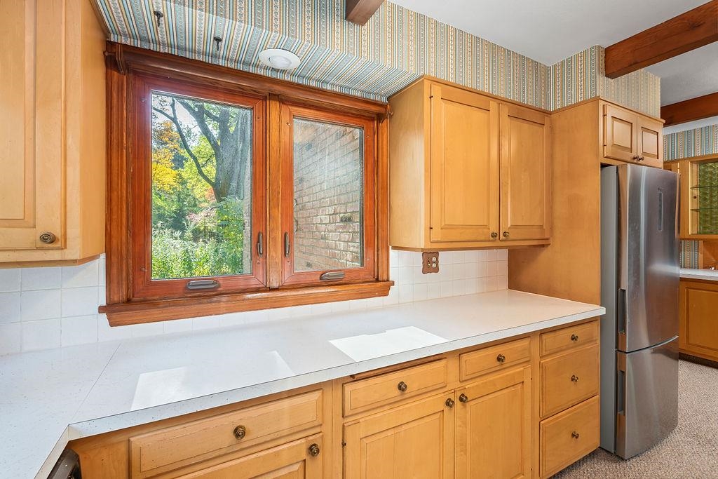 3723 Brookview Road Rockford, IL 61107 - Photo 14 of 44 a kitchen with stainless steel appliances cabinets and a window