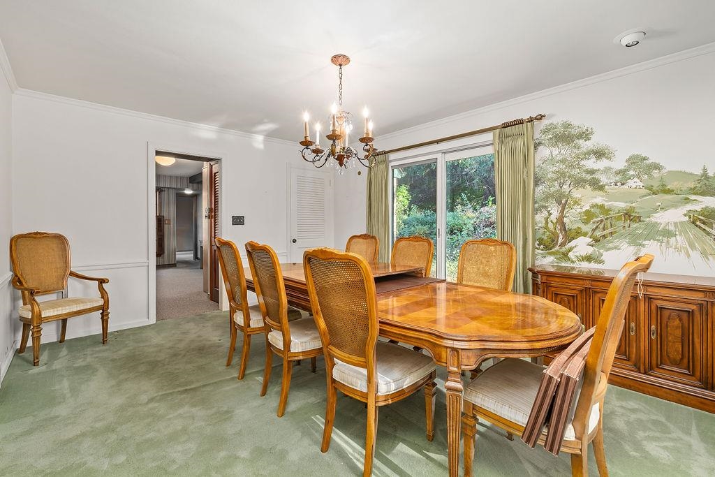 3723 Brookview Road Rockford, IL 61107 - Photo 19 of 44 a dining room with furniture a chandelier and wooden floor