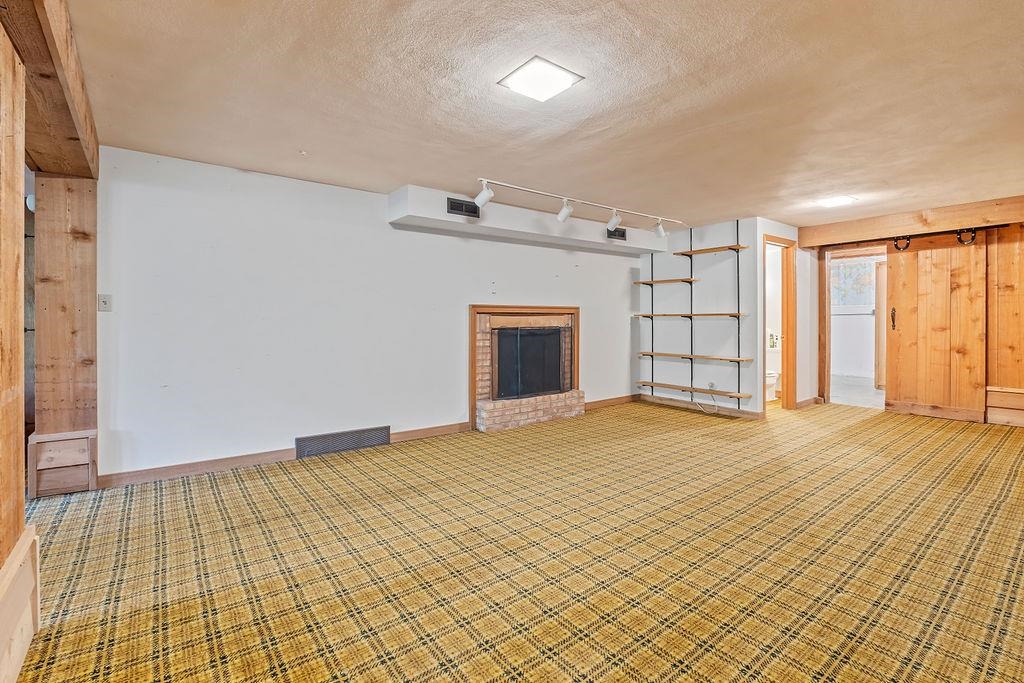 3723 Brookview Road Rockford, IL 61107 - Photo 35 of 44 a view of an empty room with a window and fireplace