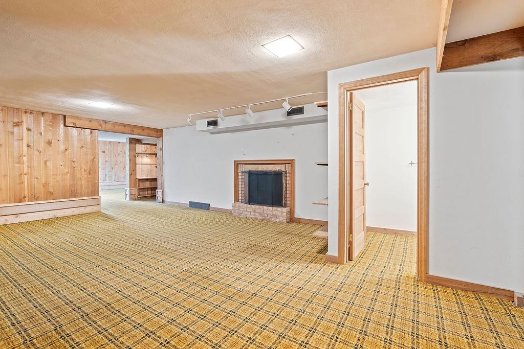 3723 Brookview Road Rockford, IL 61107 - Photo 36 of 44 a big room with windows and a fireplace