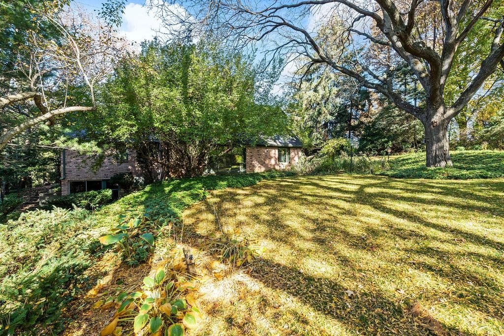 3723 Brookview Road Rockford, IL 61107 - Photo 42 of 44 a backyard of a house with lots of green space