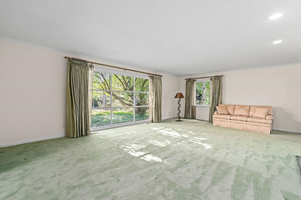 3723 Brookview Road Rockford, IL 61107 - Photo 7 of 44 a view of a livingroom with an empty space and a window