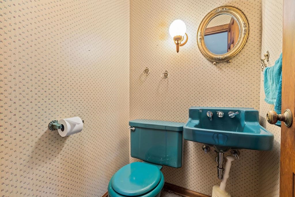 3723 Brookview Road Rockford, IL 61107 - Photo 10 of 44 a bathroom with a toilet and a sink