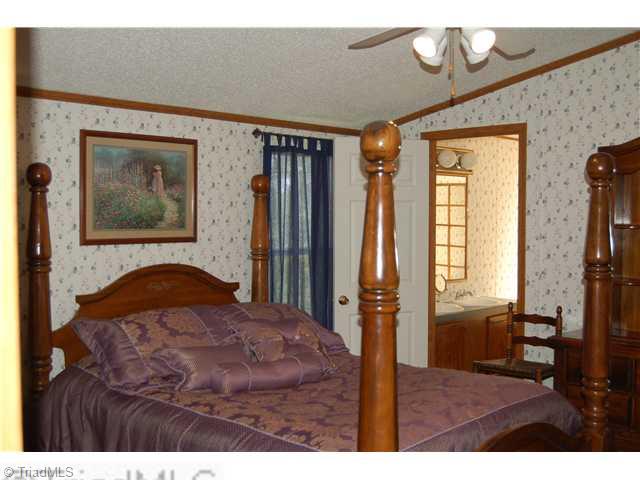 1845 Garner Road Yadkinville, NC 27055 - Photo 5 of 13 Master Bedroom.