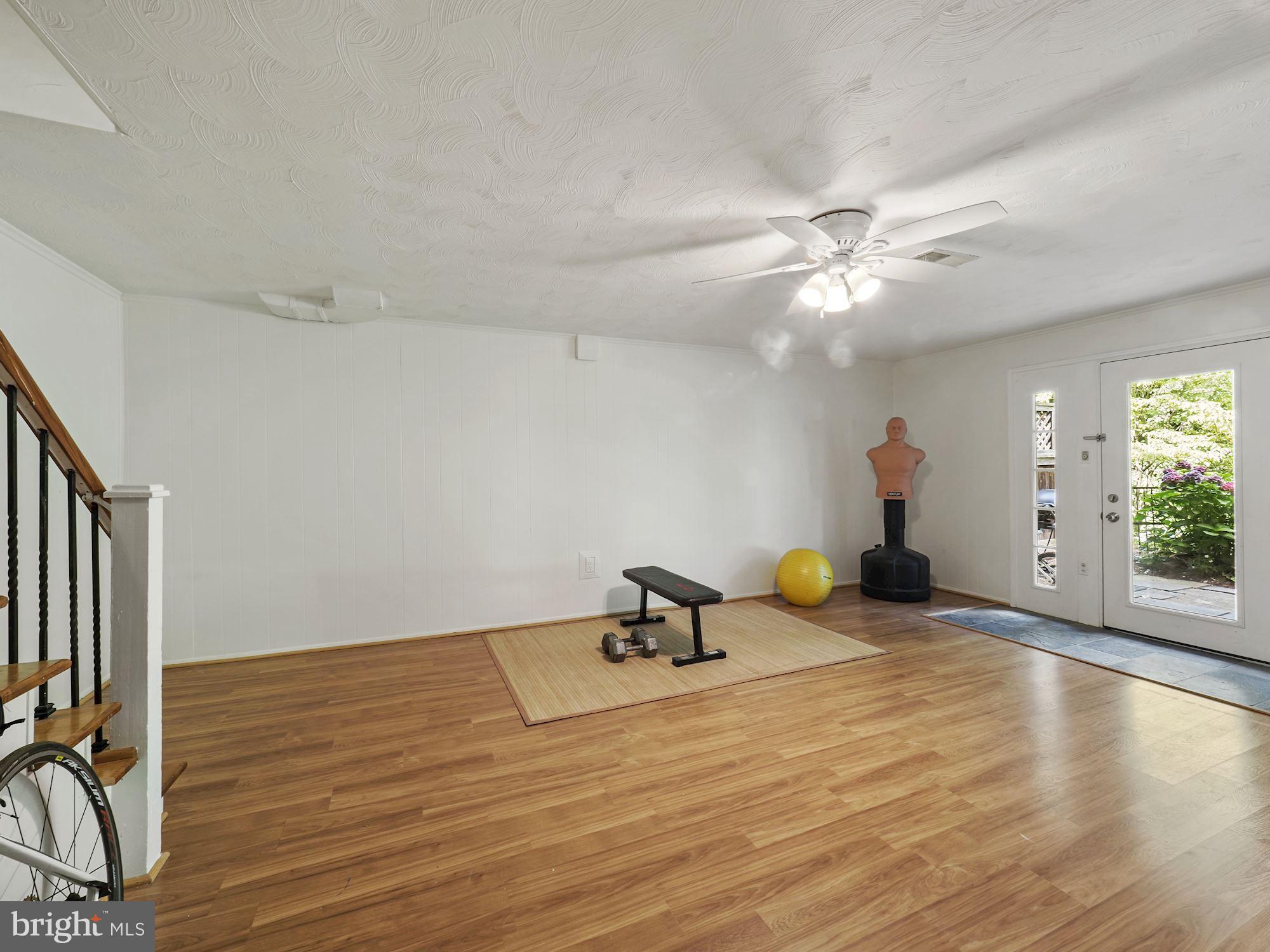 5343 Pooks Hill Road, Unit 40353 Bethesda, MD 20814 - Photo 20 of 57 a view of a room with gym equipment and windows