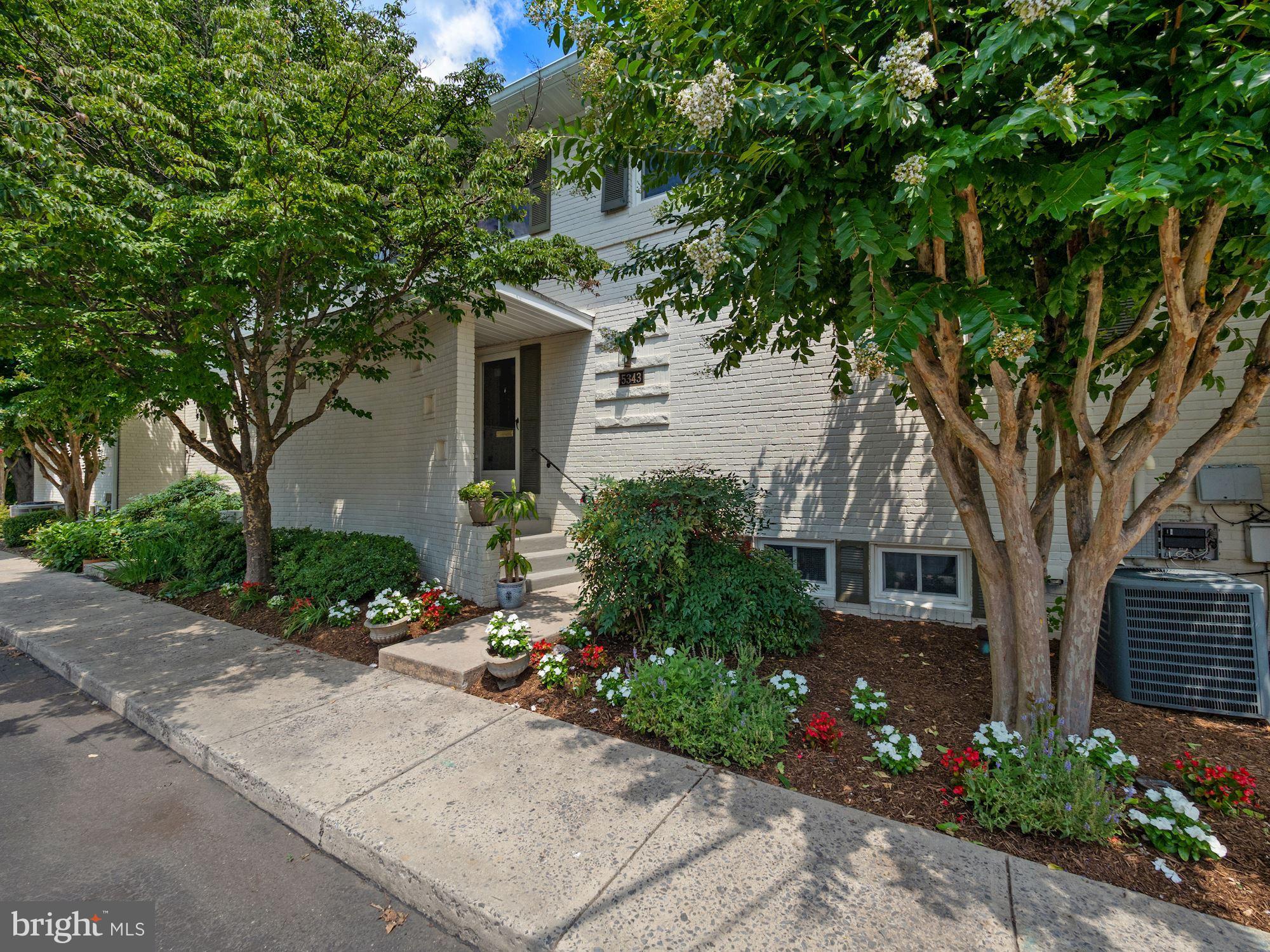 5343 Pooks Hill Road, Unit 40353 Bethesda, MD 20814 - Photo 2 of 57 a front view of a house with garden